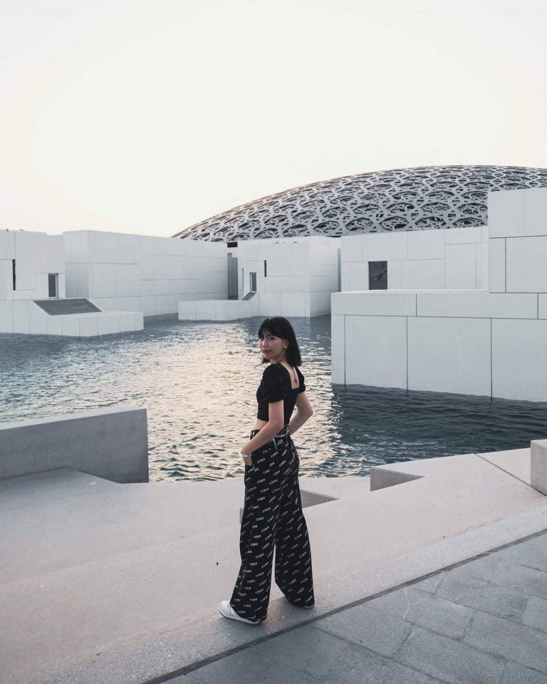 woman standing near the water