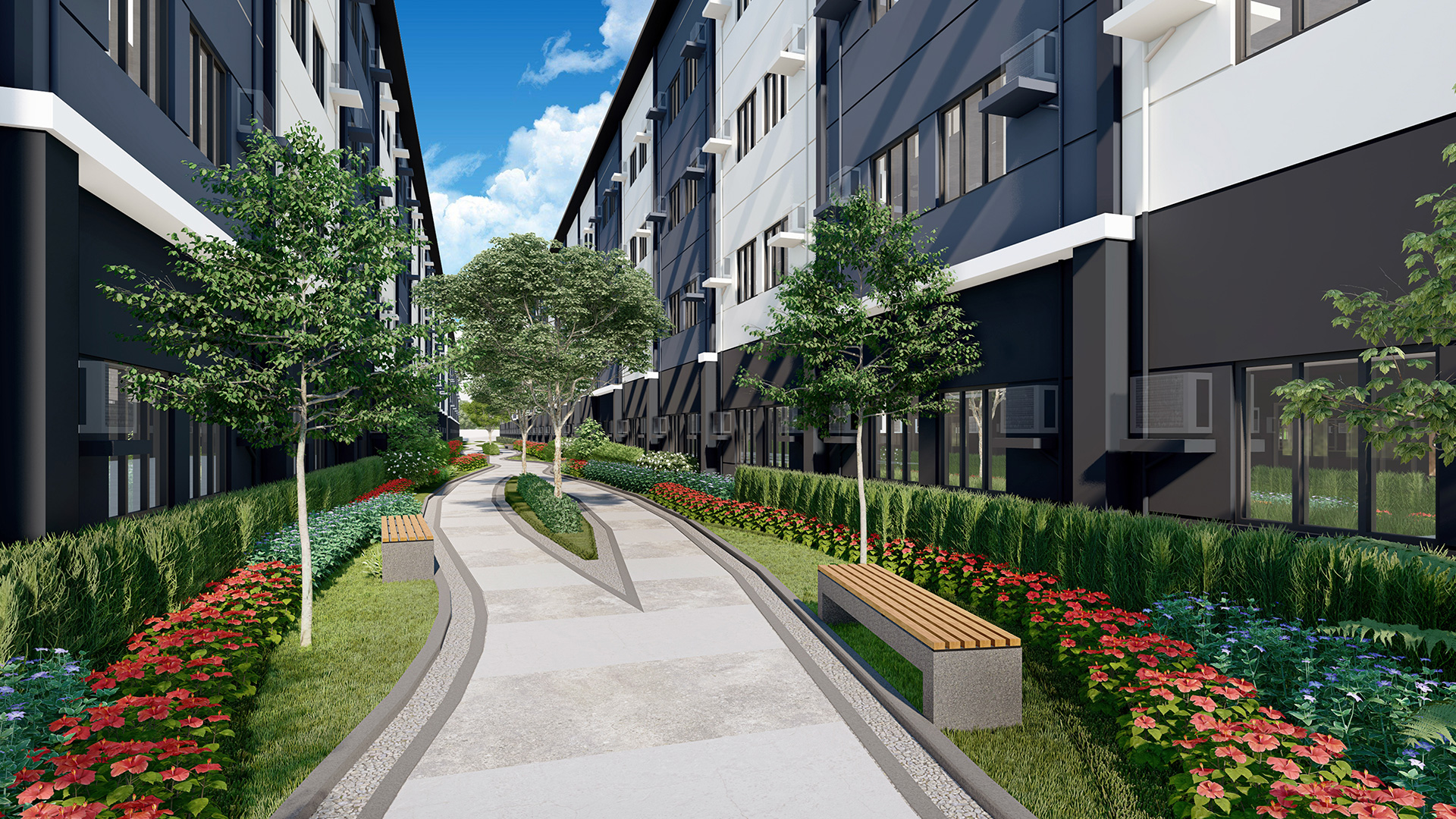 A linear park between residential buildings lined with trees, bushes, and benches.