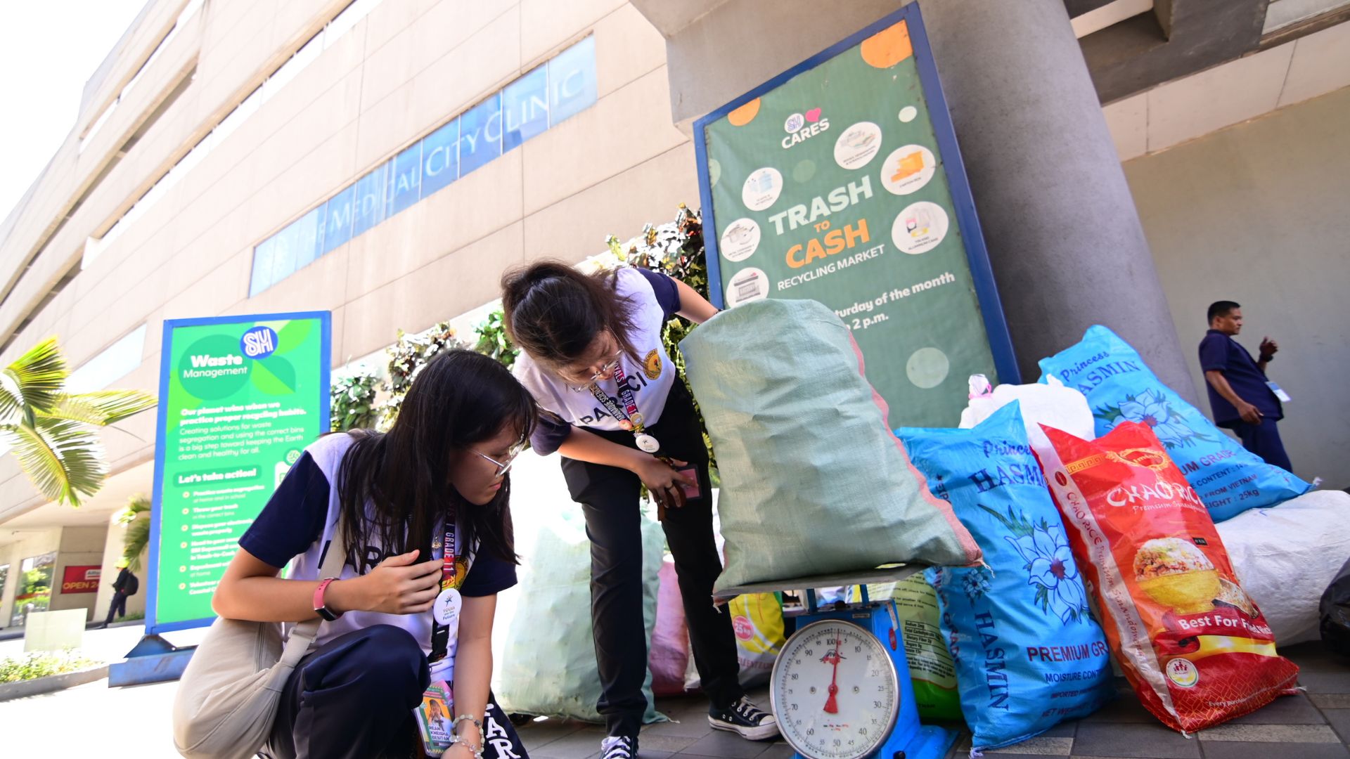 Students weighs recyclables during SM Cares’ Trash to Cash, showing that small actions can lead to a greener future.
